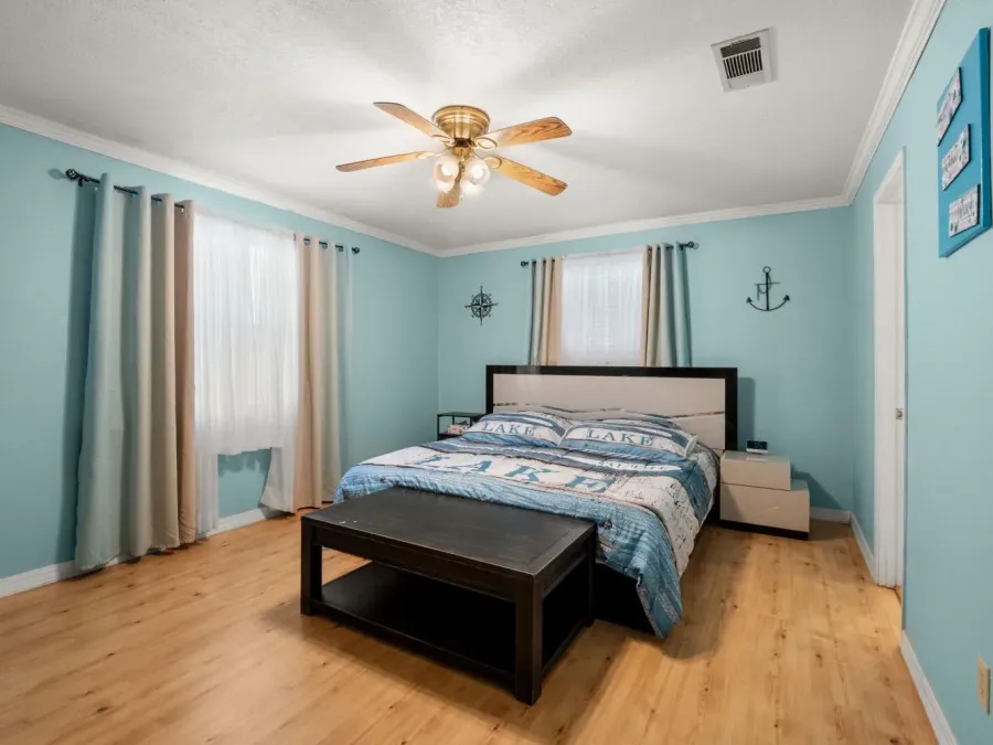 The master bedroom has a king size bed. The master bedroom has a king size bed.